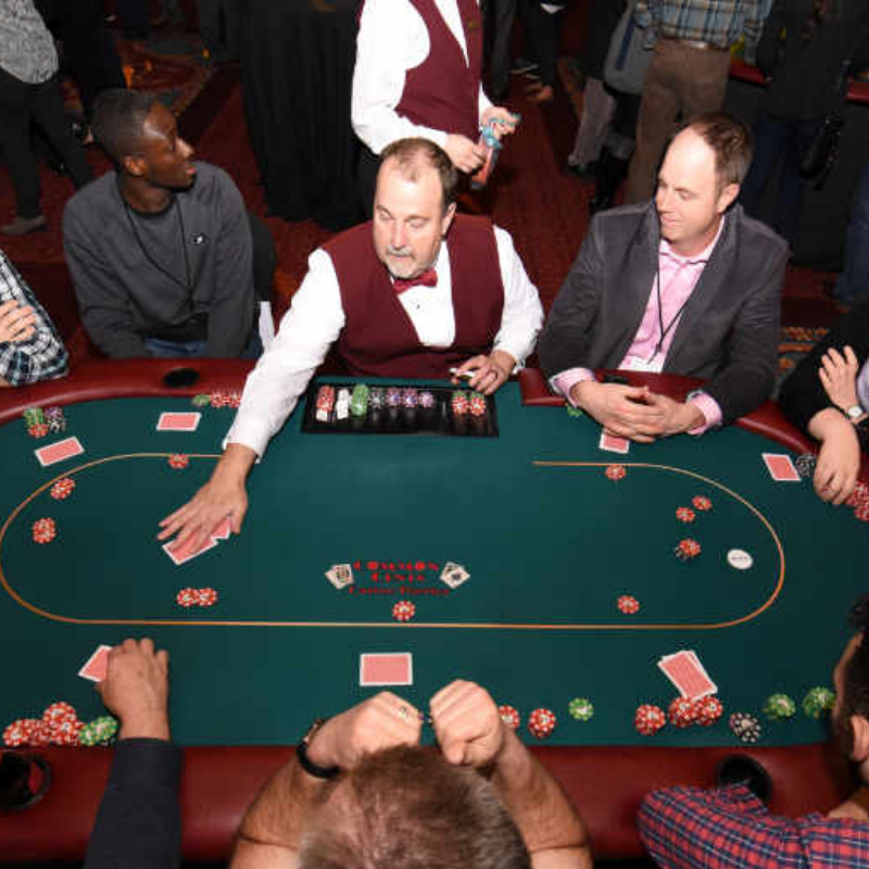 People playing Craps at a Common Cents Casino Party.